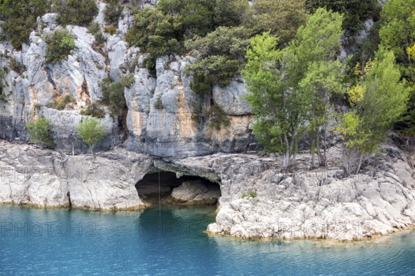 Cave on the rocky shore of Lac de Sainte-Croix, near dam, Provence-Alpes-Côte d'Azur, Provence, France, Europe