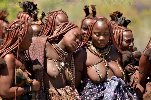 Mourning Himba women at a funeral, the widow in the middle, Omohanja, Kaokoland, Kunene, Namibia, Africa