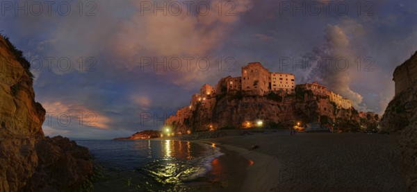 Panorama on the beach Lido Le Roccette Club Tropea with the old town of Tropea perched on sandstone cliffs and the sky lit up with clouds at sunset, Tropea, Vibo Valentia, Calabria, Southern Italy, Italy, Europe