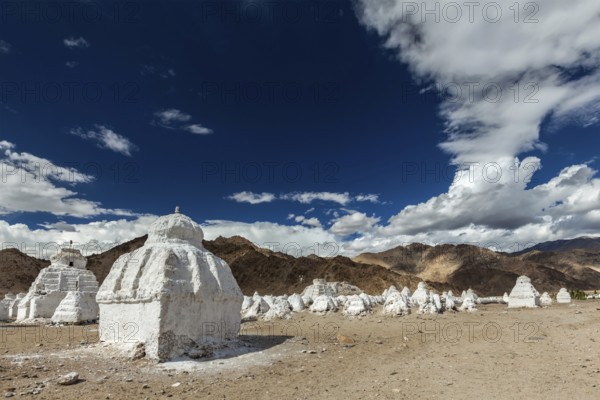 Whitewashed chortens (Tibetan Buddhist stupas) . Ladakh, Jammu and Kashmir, India, Asia