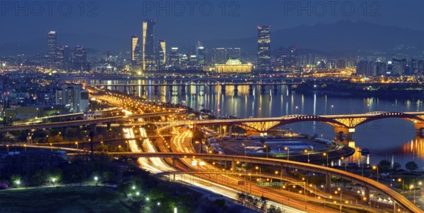 Aerial panorama of Seoul downtown cityscape and Seongsan bridge over Han River in twilight. Seoul, South Korea, Asia