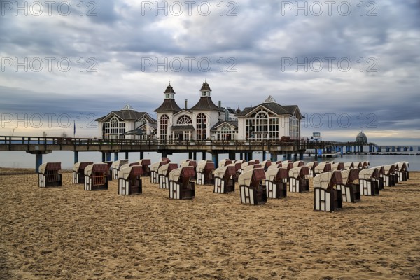 Empty beach chairs in front of the pier Sellin at dusk, long exposure, Baltic resort Sellin, Insel Rügen, Mecklenburg-Vorpommern, Germany, Europe