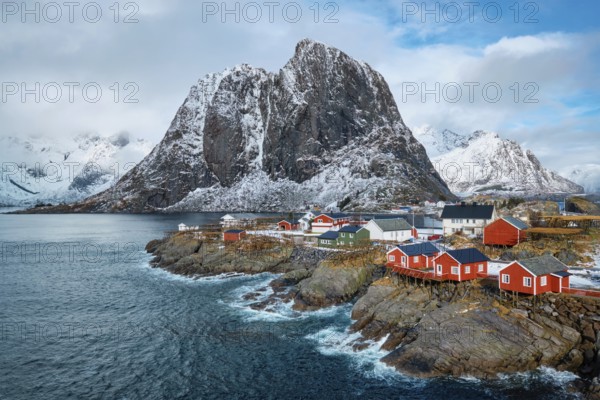 Hamnoy fishing village with red rorbu houses in Norwegian fjord in winter. Lofoten Islands, Norway, Europe