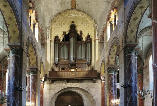 Organ loft of Saint Austremoine church, Issoire. Puy de Dome department. Auvergne-Rhone-Alpes, France, Europe