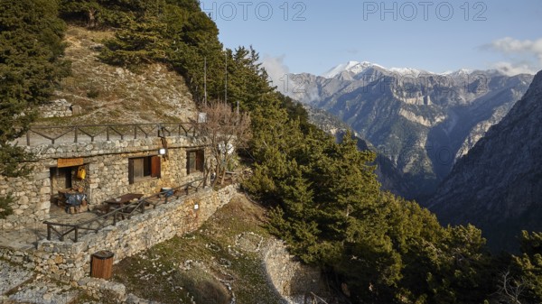 Entrance to the gorge, entrance, ticket office in the rock, terrace, snow-capped mountains, Xyloskalo, Samaria Gorge, Omalos, Lefka Ori, White Mountains, West Crete, island of Crete, Greece, Europe