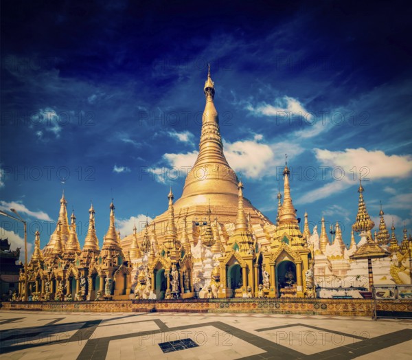 Vintage retro effect filtered hipster style image of Myanmer famous sacred place and tourist attraction landmark, Shwedagon Paya pagoda. Yangon, Myanmar, Asia