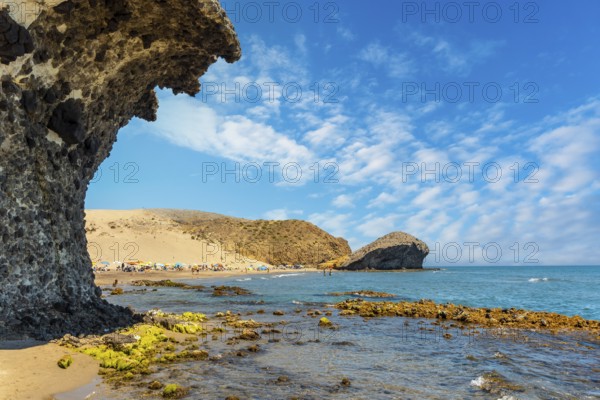 Summer at Monsul Beach in the Cabo de Gata Natural Park, created with eroded lava formations in the municipality of San Jose, Almeria. Spain