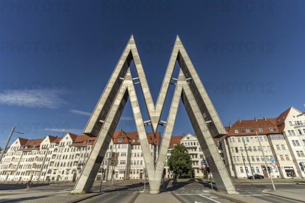 The huge double-M logo of the Leipzig Trade Fair Centre at the East Gate of the Old Leipzig Trade Fair Centre in Leipzig, Saxony, Germany, Europe