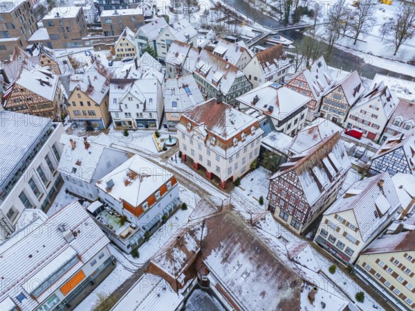 Aerial view of a snow-covered town with many roofs in a wintry atmosphere, Nagold, Town Hall Black Forest, Germany, Europe