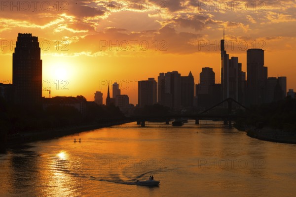 The sun sets behind the Frankfurt banking skyline, Frankfurt am Main, Hesse, Germany, Europe