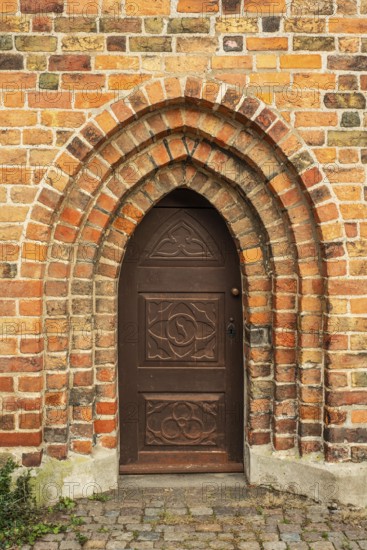 Old door in a brick wall in the monastery church in Ystad, Skåne Country, Sweden, Scandinavia, Europe