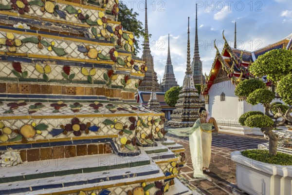 Wat Pho Temple is Bangkok's oldest Buddhist monastery near the Grand Palace. Four chedis are among the most precious in Bangkok. Temple dancer. Bangkok, Thailand, Asia