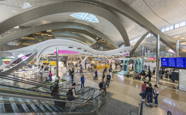Abu Dhabi Airport, Zayed International Airport with passengers. Duty free shop. The new Terminal A has a capacity of 45 million passengers per year. Modern architecture. Abu Dhabi, United Arab Emirates, UAE, Asia