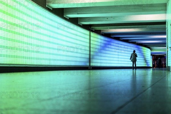 Passage under Essen's main railway station, connects entrances to the city and the main railway station, with the underground station, illuminated, LED wall, few people, Germany, Europe