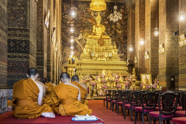 Wat Pho temple in Bangkok near the Grand Palace. Buddhist monks during a religious ceremony. Bangkok, Thailand, Asia