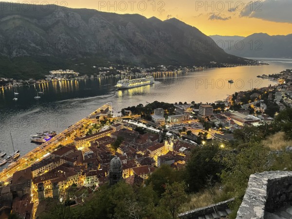 Evening atmosphere, sunset, view of the old town of Kotor from above, Bay of Kotor, cruise ship, Adriatic Sea, Mediterranean Sea, World Natural and Cultural Heritage, Kotor, Montenegro, Europe