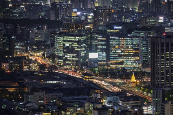 Seoul skyscrapers and Gyeongbokgung palace illuminated with lights view from Inwang mountain. Seoul, South Korea, Asia