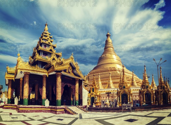Vintage retro effect filtered hipster style image of Myanmer famous sacred place and tourist attraction landmark, Shwedagon Paya pagoda. Yangon, Myanmar, Asia