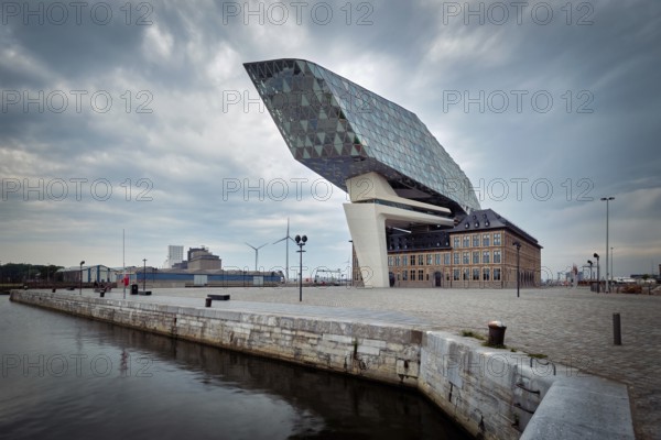 ANTWERP, BELGIUM, MAY 27, 2018: Antwerp port administration headquarters, designed by famous iranian architect Zaha Hadid, Antwerpen, Belgium which was her last project in stormy weather