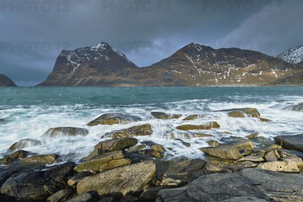 Rocky coast of fjord of Norwegian sea in winter. Lofoten islands, Norway, Europe