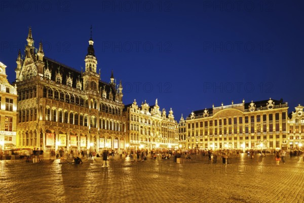 BRUSSELS, BELGIUM, MAY 31, 2018: Grote Markt (Grand Place) square crowded with tourists illuminated at night. Bruxelles, Belgium, Europe