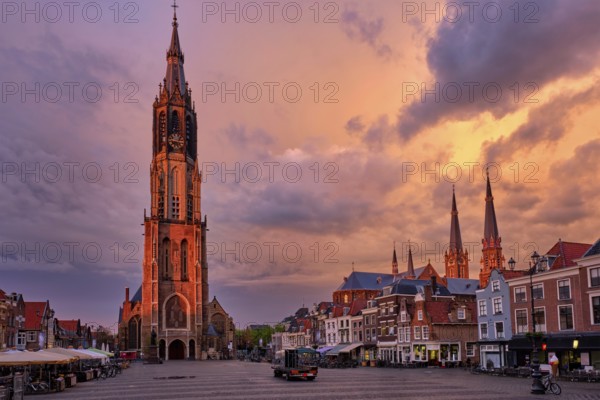 Delft, Netherlands, May 12, 2017: Nieuwe Kerk New Church protestant church on Delft Market Square Markt with dramatic sky on sunset. Delft, Netherlands