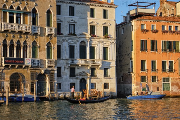VENICE, ITALY, JUNE 27, 2018: Grand Canal with boats and gondolas on sunset, Venice, Italy, Europe