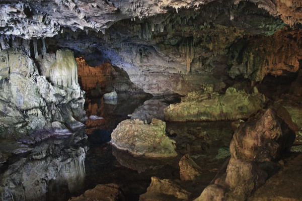 Neptune cave, stalactite cave with lake, colourful rocks, bizarre landscape, Sardinia, Italy, Europe