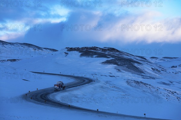 Snow removal vehicle on ice on Ring Road No. 1, snow-covered geothermal area, North Iceland Eyestra, Iceland, Europe