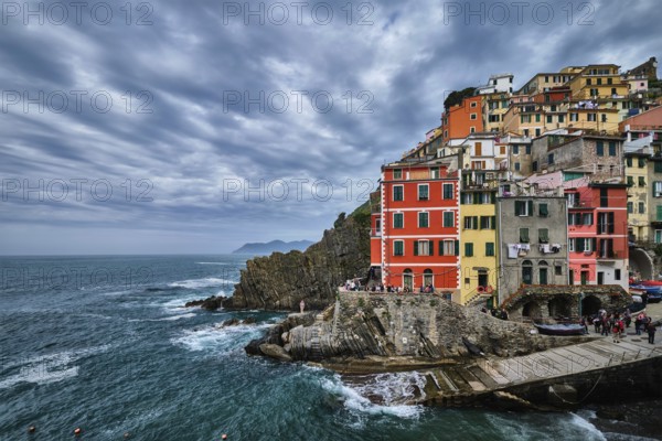 RIOMAGGIORE, ITALY, APRIL 25, 2019: Riomaggiore village popular tourist destination in Cinque Terre National Park a UNESCO World Heritage Site, Liguria, Italy in stormy weather