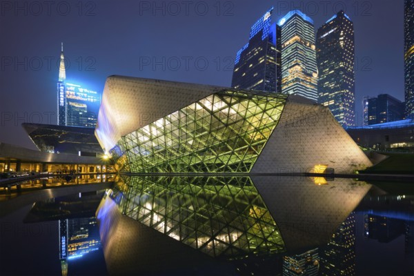 GUANGZHOU, CHINA, APRIL 27, 2018: Guangzhou Opera House designed by famous Iraqi architect architect Zaha Hadid illluminated at night