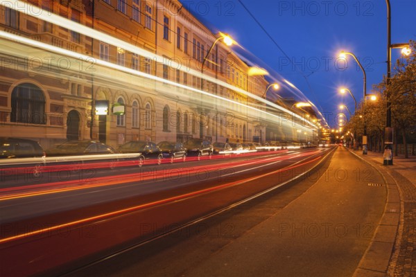 Blurred light trails of Prague tram in twilight. Prague, Czech republic