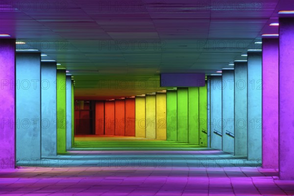 Colorful mulitcolord illuminated gallery tunnel rainbow passage under NAI building, Nederlands Architecture Institute near Museum Park, Rotterdam, The Netherlands, Europe