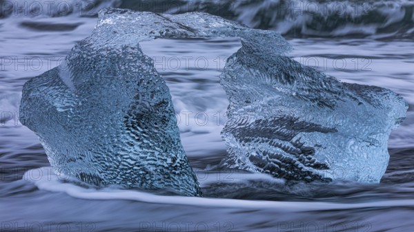 Artfully shaped iceberg on the black beach of Breidamerkursandur, near Jökullsarlon, Sudurland, Iceland, Europe