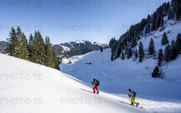 Two ski tourers in a wintry mountain landscape, ascent to Roßkopf, Mangfallgebirge, Bavaria, Germany, Europe