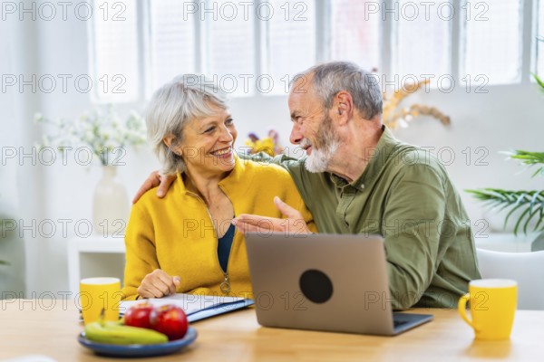 Happy senior woman receiving good news with online notification and her husband congratulate her