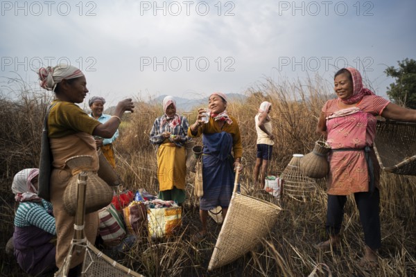 Villagers participate in a community fishing event on the occasion of the Bhogali Bihu festival at Panbari village in Assam on 13 January 2025. Magh Bihu, also known as Bhogali Bihu, is one of the most vibrant festivals celebrated in Assam and other parts of Northeast India
