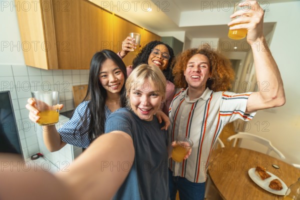 Group of cheerful multi ethnic friends taking a selfie while drinking juice and enjoying a party in a modern kitchen