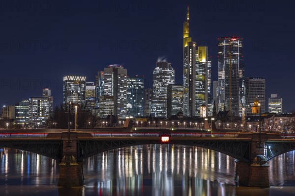 The lights in the offices of the Frankfurt banking skyline glow in the evening, Frankfurt am Main, Osthafen, Hesse, Germany, Europe