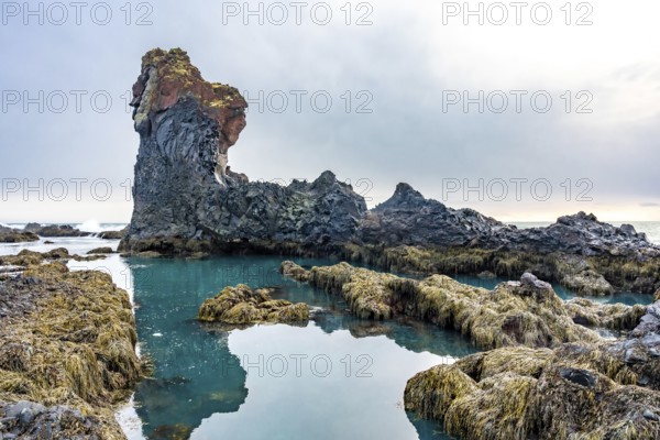 Beautiful rock formations by the sea at Djupalonssandur beach on the Snaefellsnes peninsula in winter in Iceland