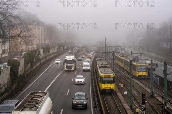 Dense fog, with visibility sometimes less than 100 metres, A40 motorway, city passage in Essen, underground line U18 in the middle lane, North Rhine-Westphalia, Germany, Europe