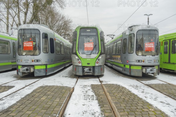 View of a TW 3000 and TW 2000 train of the Üstra with a strike poster stuck to the windscreen, Verdi, strike, trade union, Hanover, Lower Saxony, Germany, Europe