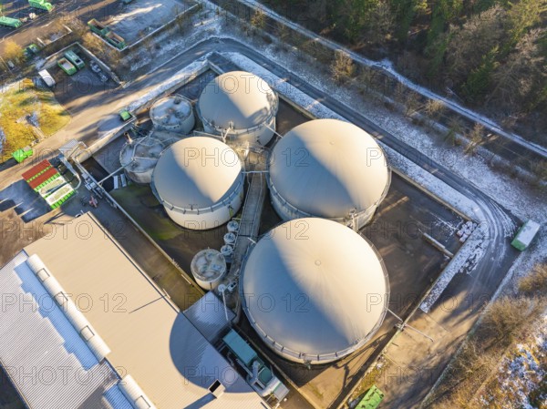 Industrial plant with large tanks in a slightly snow-covered, wooded area, Neubulach, Black Forest, Germany, Europe