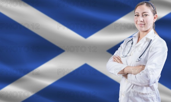 Female doctor on Scottish flag. Doctor with crossed arms on Scottish flag. Scotland health and care concept
