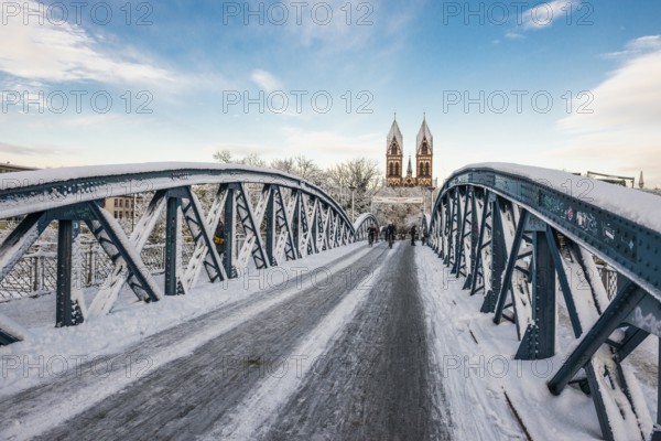 Bridge with snow and ice and cyclists, Blue Bridge and Stühlinger Church, Freiburg im Breisgau, Black Forest, Baden-Württemberg, Germany, Europe