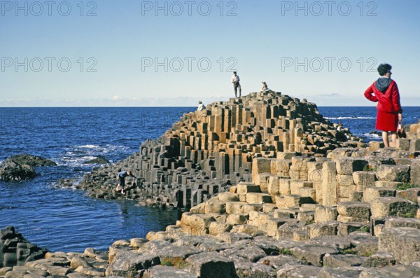 People exploring the Giant's Causeway, Antrim Coast, Northern Ireland, Great Britain 1960s
