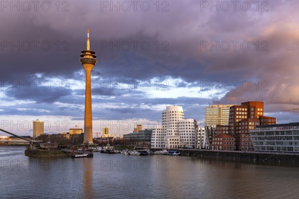 Gehry buildings - Neuer Zollhof at the Media Harbour and the Rhine Tower in Düsseldorf, North Rhine-Westphalia, Germany, Europe