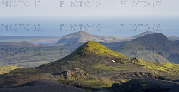 Volcanic mountain landscape overgrown with moss, atmospheric mountain landscape in the evening light, Pakgil, Iceland, Europe