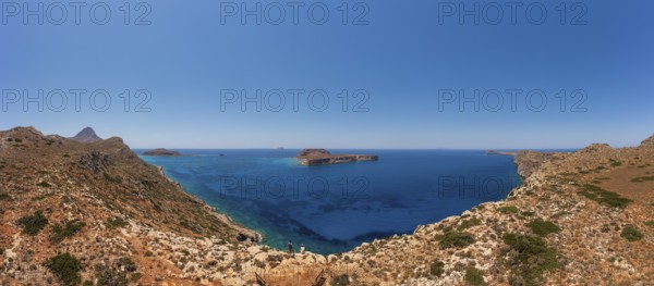 Hikers on the way to the cape of the Gramvousa peninsula with a view of the island of Imeri Gramvousa, Kolimbari, West Crete, Crete, Greece, Europe