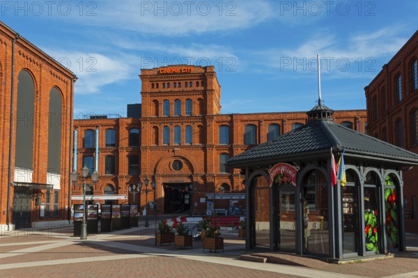 Historic red brick building complex with modern pavilion in an urban setting, Manufaktura, Lódz, Lodz, Lodz, Poland, Europe